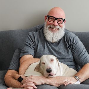 Distorted bald white man with six arms, way too many figures, and a distorted dog